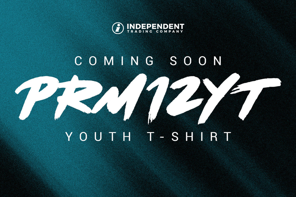 Coming Soon: PRM12YT Youth T-Shirt from Independent Trading Company, in white brush lettering on a dark teal background.