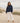 Independent Trading Co. IND280MOCK Women's Midweight Mockneck Sweatshirt in color Classic Navy on a woman standing on the beach