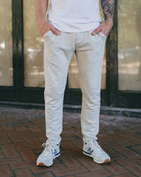 man wearing a light color sweat pant